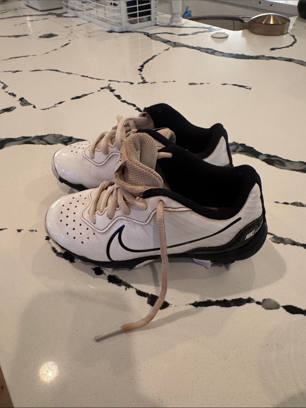 Nike Kids White and Black Cleats with Swoosh